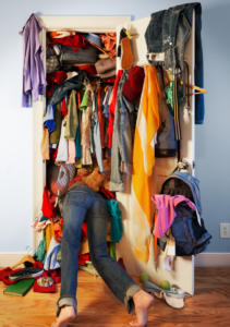 Woman buried in a messy closet