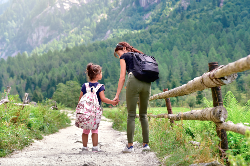 mother and young daughter going on a hike
