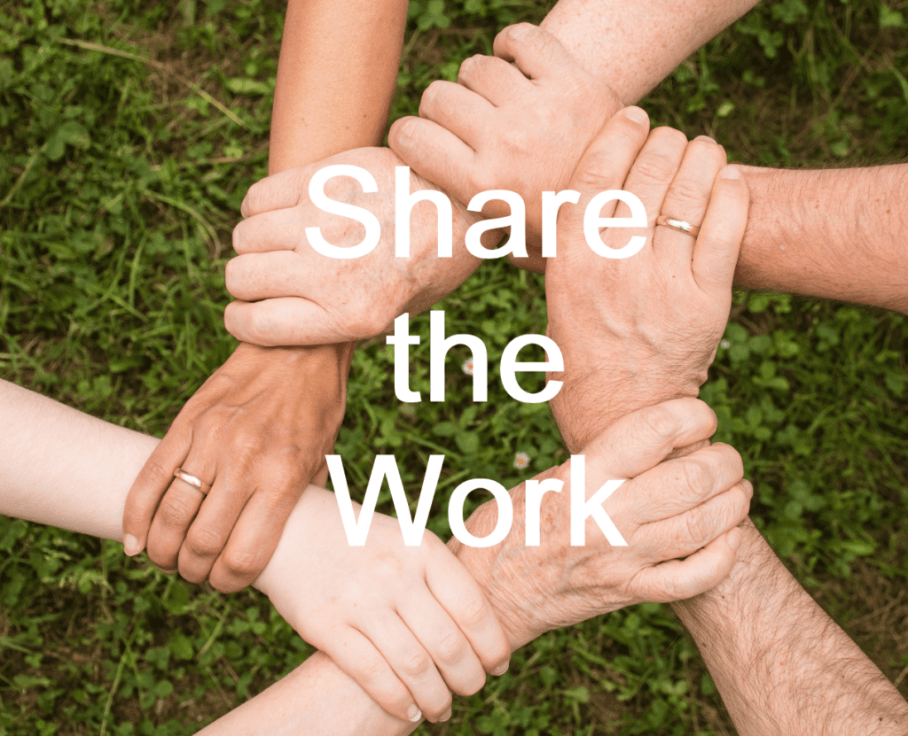 6 people interlocking hands to form a hexagon