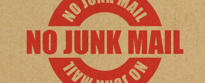 Brown bag background with the red words "No Junk Mail" written on top