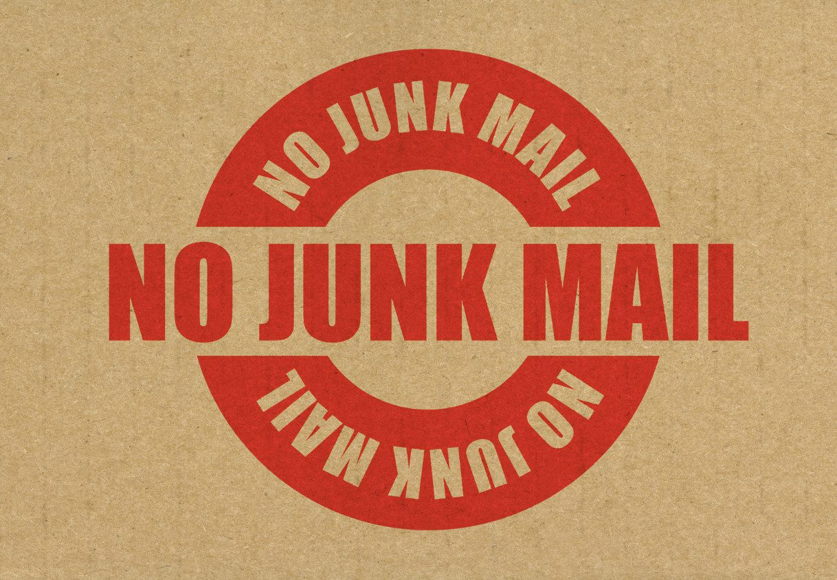 Brown bag background with the red words "No Junk Mail" written on top