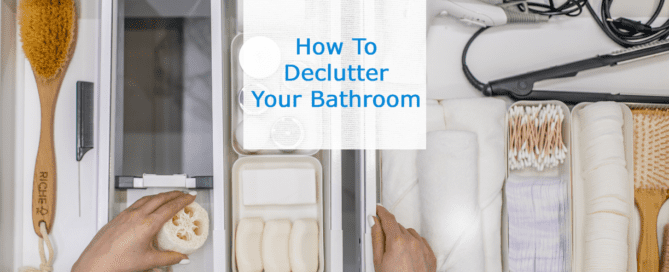 Woman's hands pulling something out of a very organized bathroom drawer with text saying ' How To Declutter Your Bathroom'