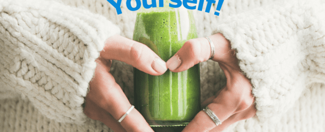 Woman in white sweater holding a green smoothie over her stomach and arranging hands in shape of a heart. Tagline says "Reward Yourself!"