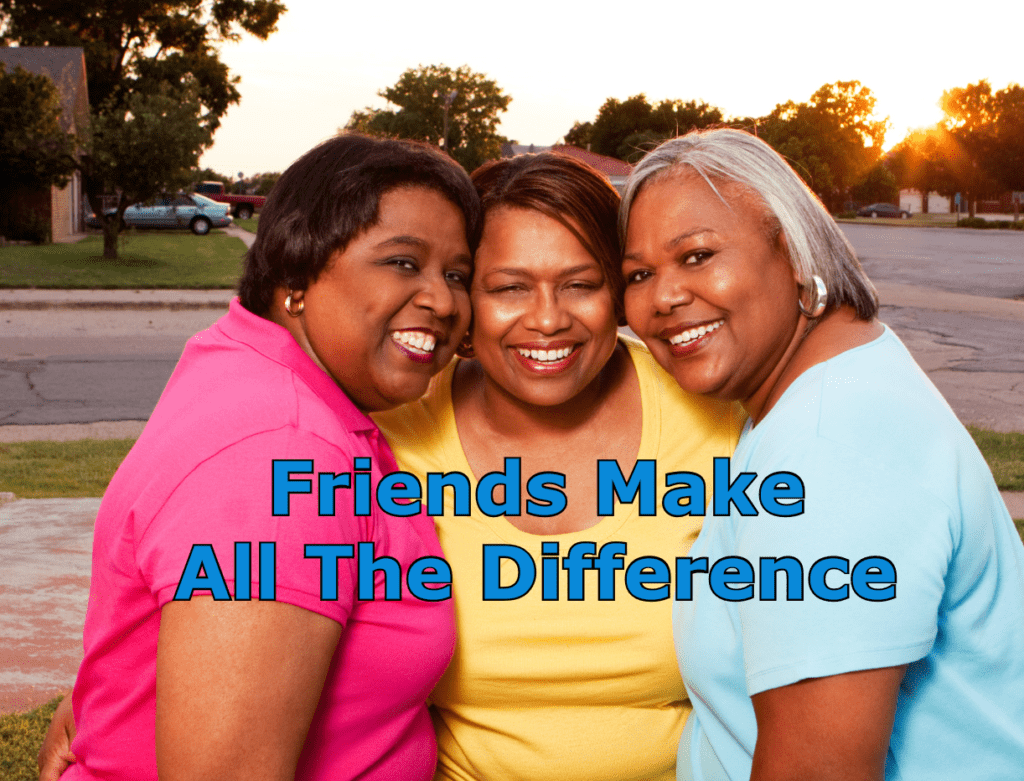 3 mature women smiling as they hug