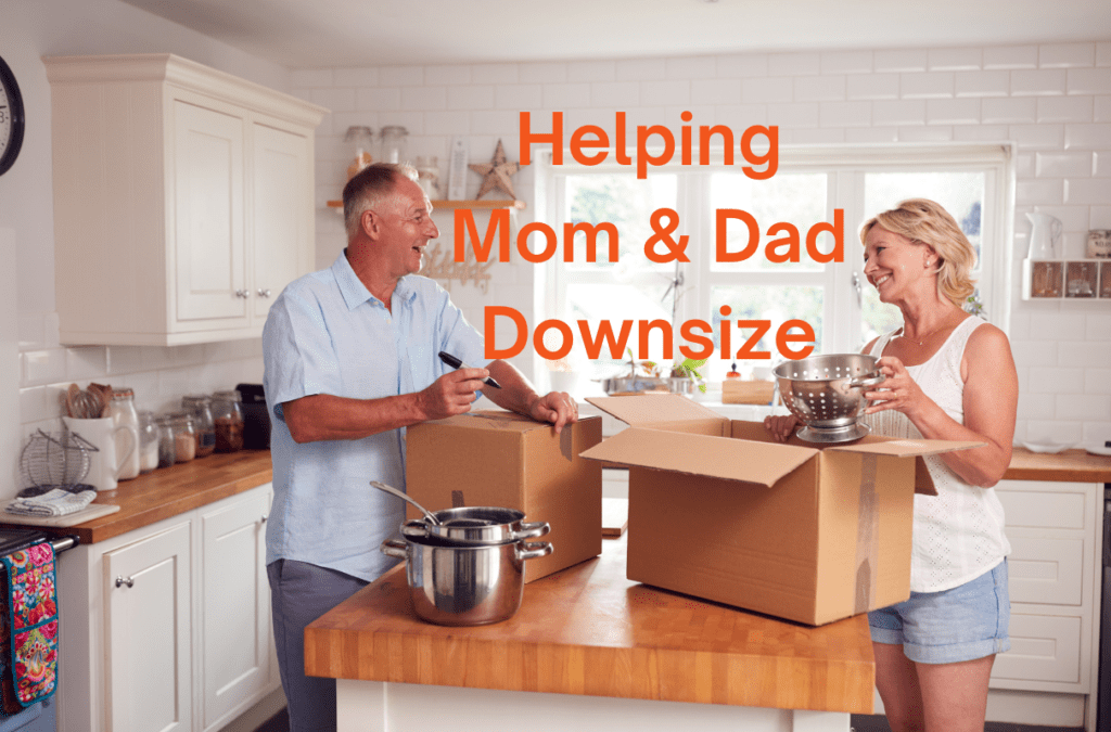 Senior dad and daughter standing in kitchen packing boxes as he downsizes